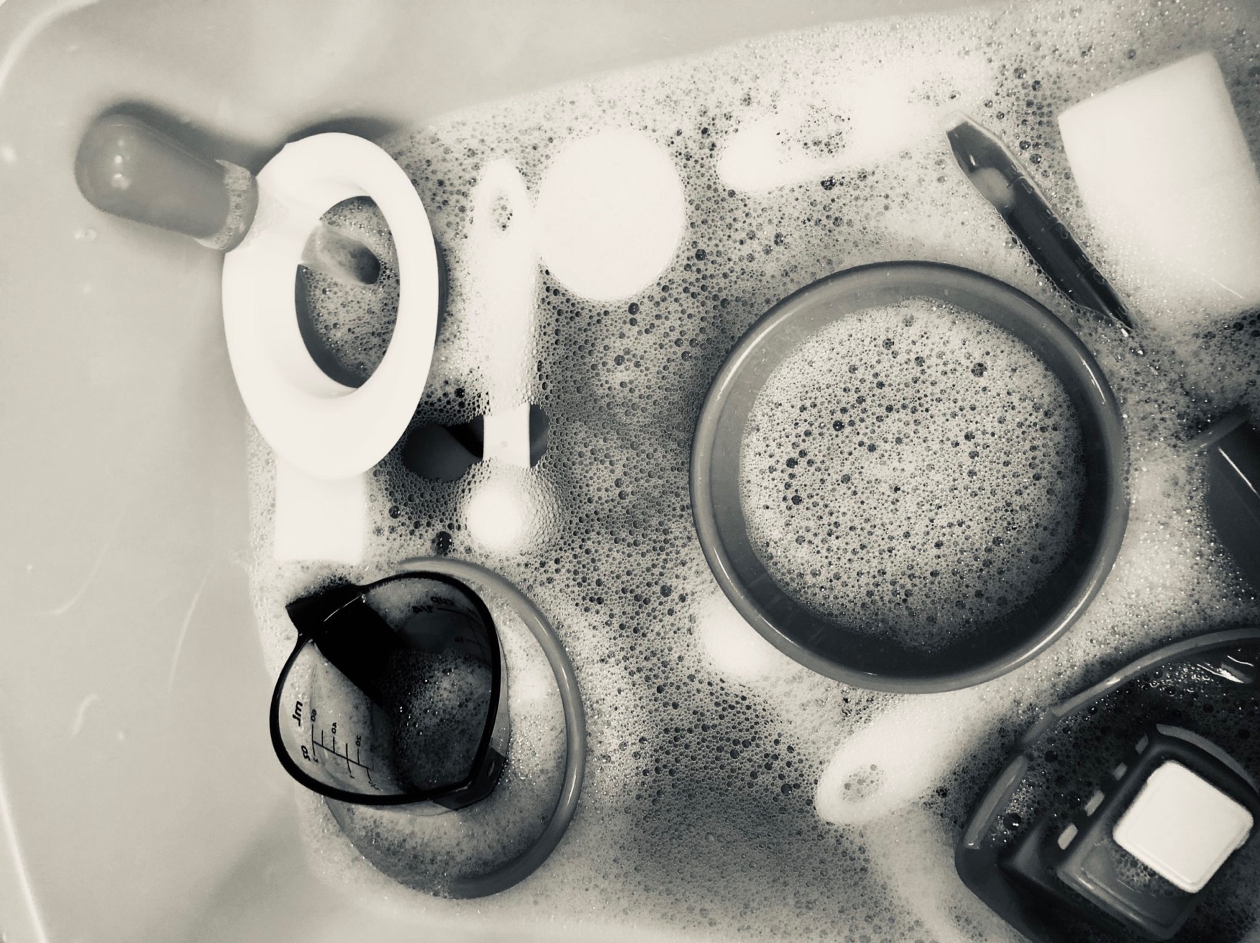 Sensory bin with scoops and cups