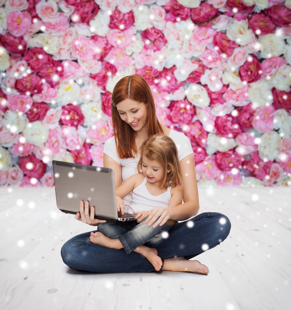 Mother and daughter using Laptop