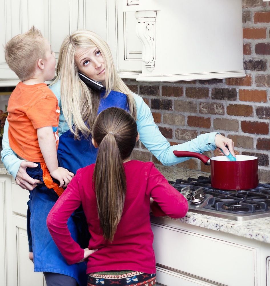 Overwhelmed mom in kitchen