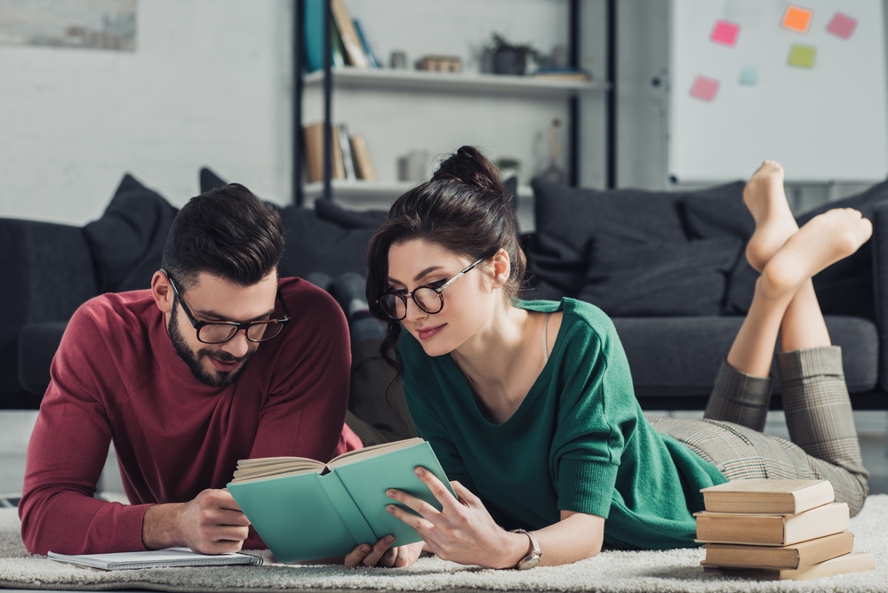 Couple reading book together