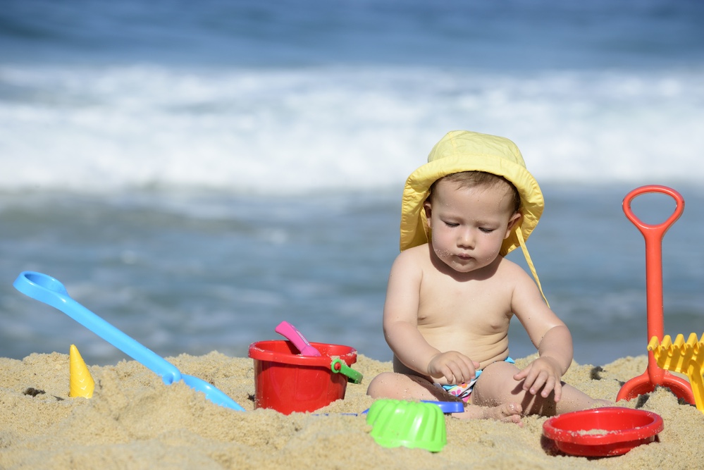 Baby playing on beach