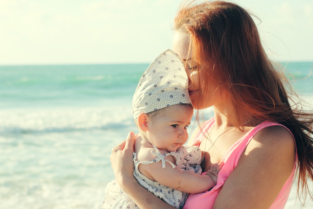 Mom and baby on beach