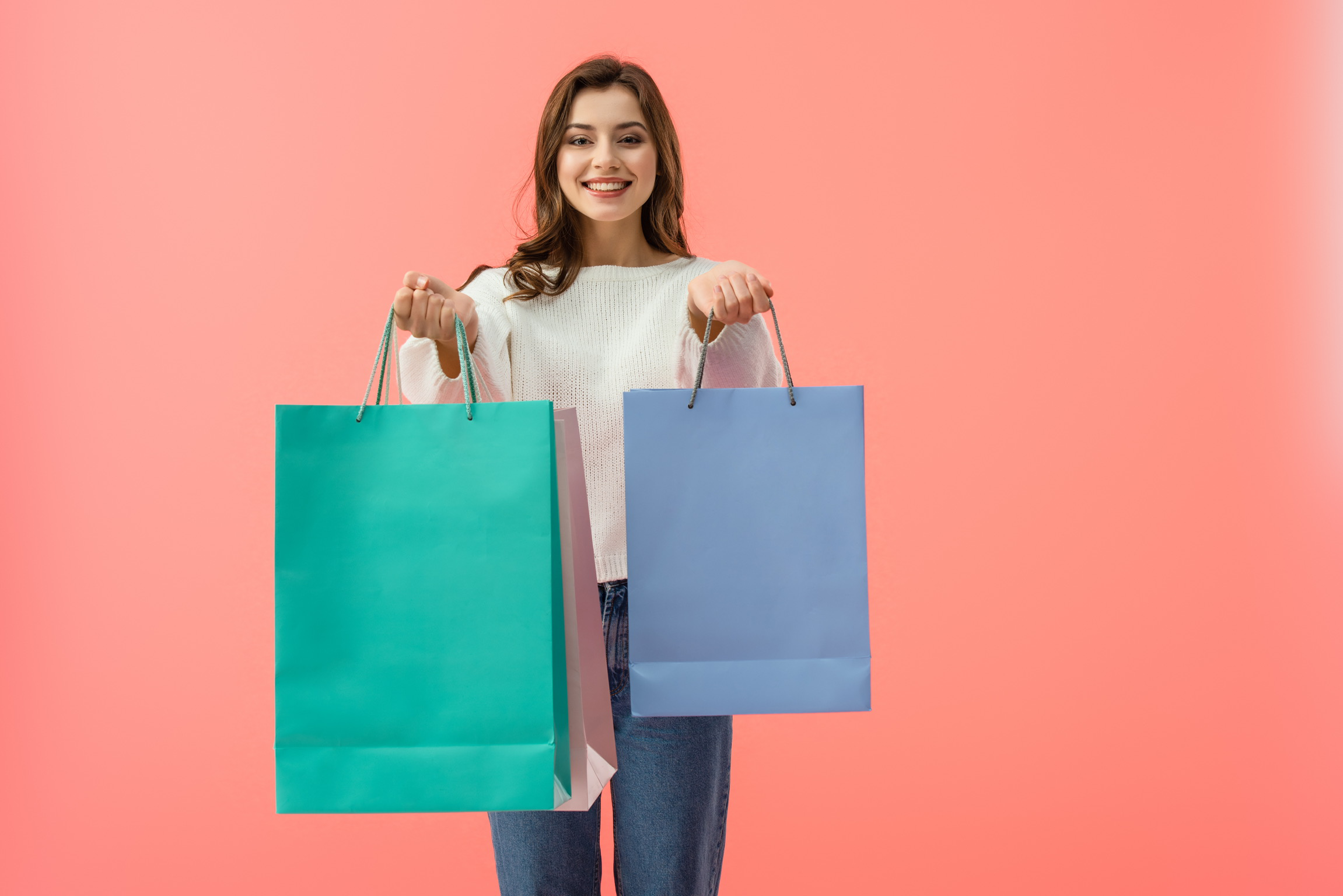 Happy woman with shopping bags. Value concept.