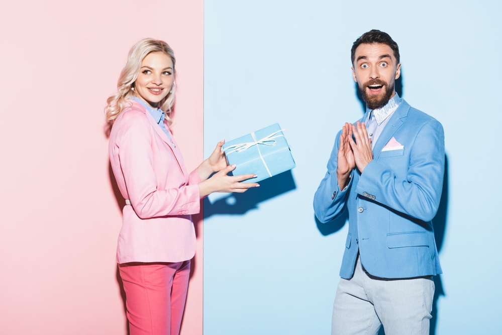 Woman giving man Valentine’s gift